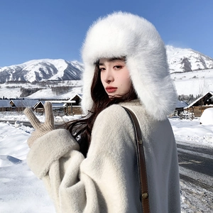 Winter plush trapper hat in white faux fur with earflaps and casual outdoor snowy style