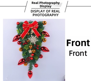 Front view of Christmas teardrop swag with red bow, golden balls and wooden snowflakes