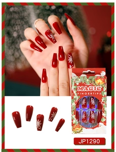 Detailed view of red Christmas coffin press on nails with snowflake patterns and packaging
