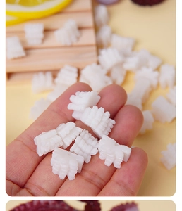 Macro detail of miniature PVC squid cube with realistic texture for DIY food play
