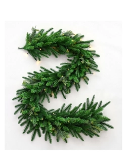 Detail of 1.8m evergreen Christmas garland with warm yellow LED lights on white background