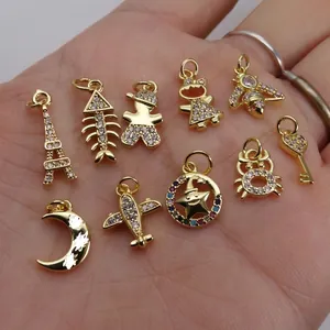 Golden micro-paved zircon charms including moon, stars, and bear for DIY jewelry making