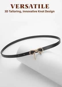 Detail of slim black PU leather belt with gold bow buckle and multiple adjustment holes