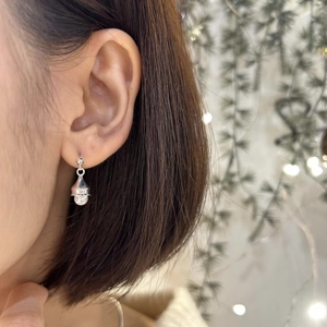 Elegant 925 silver bell earrings with white pearl detail shown on a female model