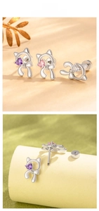 Close-up of cat-shaped earrings with heart-cut zircons and secure screw-back structure