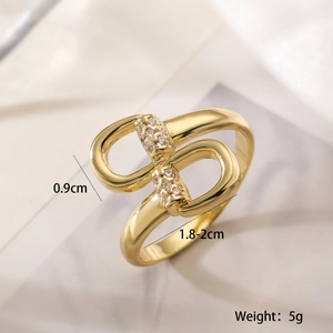 Detail view of gold double ring with zircons showing dimensions of 0.9cm width and 5g weight