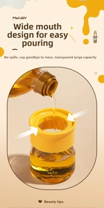 Detail of wide mouth glass oil bottle with silicone brush for easy pouring and refilling