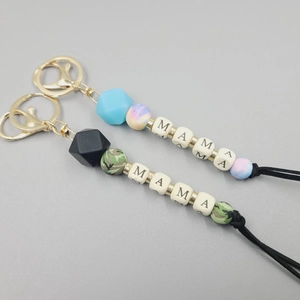 Detail of MAMA letter beads and silicone geometric charms on a stylish keychain
