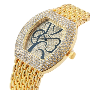Luxury gold women's watch with sparkling crystals and elegant floral numerals