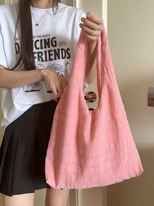 Pink minimalist tote bag with textured fabric and large capacity for casual commuting