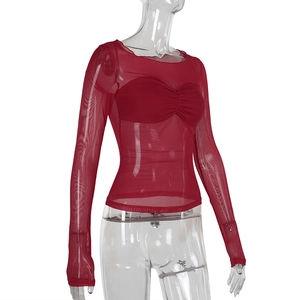Detailed side view of the sheer red mesh long sleeve top and matching inner bandeau