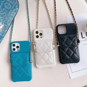 Detail view of quilted leather phone cases with card slots and gold chain straps