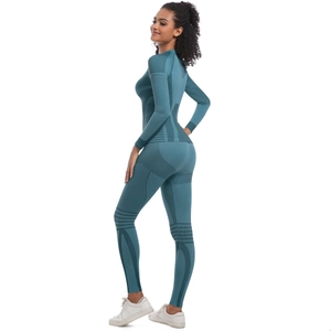Detail view of seamless teal yoga set showing ribbed textures and tight fit on back