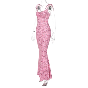 Detail of adjustable tie-up shoulder straps on a pink floral print maxi summer dress