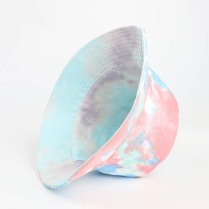 Detail shot of a double-sided tie-dye bucket hat featuring pink and blue swirl patterns