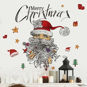 Stickers muraux de Noël avec Père Noël et décor de sapin sur une cheminée blanche