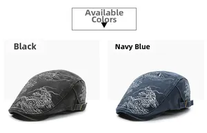 Detail of vintage denim flat caps showing intricate dragon embroidery and metal side buckles