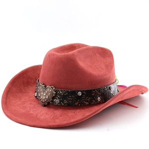 Detail of western cowboy hat featuring rust suede, paisley band and heart metal buckle
