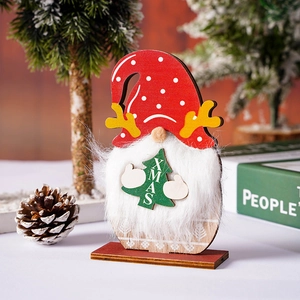 Macro view of Christmas gnome wooden ornament with polka dot hat and white plush beard