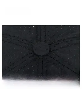 Detail shot of the breathable mesh crown and reinforced stitching on a black outdoor sports cap
