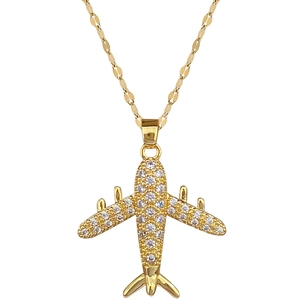 Luxurious gold airplane pendant necklace with shimmering crystals on a sleek O-chain