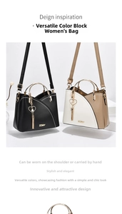 Close-up of contrast color handbag featuring gold metal handles and a pearl heart charm