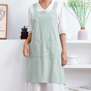 Linen cross back H-style apron in light green with two large front pockets for home use