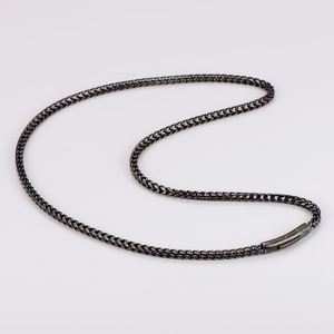 Close-up of vintage grey stainless steel foxtail chain with cylindrical clasp