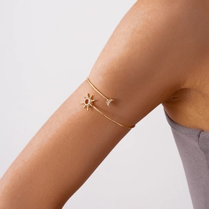 Golden sun and moon open arm cuff with sparkling crystals for elegant women's jewelry