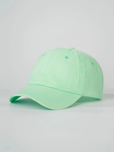 Detail view of mint green cotton baseball cap showing six-panel crown and curved brim