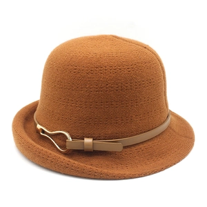 Warm brown knitted bucket hat for women with leather strap and gold buckle accent