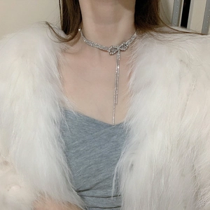 Elegant rhinestone bow choker necklace with tassels and sparkly silver finish for women