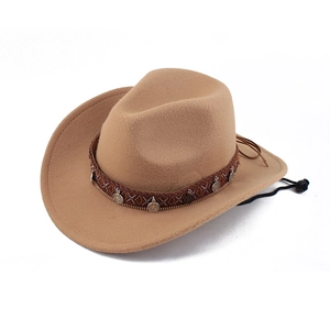 Detail of khaki wide brim cowboy hat featuring ethnic woven band and metal coin charms