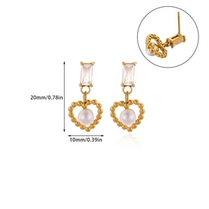 Detailed view of heart-shaped gold pearl earrings with dimensions 20mm by 10mm
