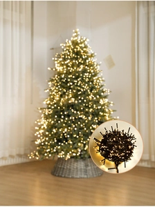 Detail of warm white LED string lights on a Christmas tree for cozy holiday decor