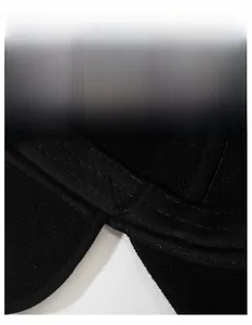 Macro detail of widened moisture-wicking sweatband inside a black winter baseball cap