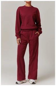 Close-up of ribbed cuffs and high-waist drawstring details on burgundy lounge set
