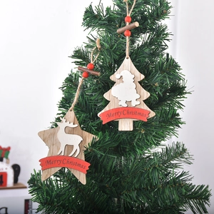 Wooden Christmas ornaments set featuring deer and star shapes on a festive tree