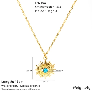 Detail view of 18k gold plated stainless steel sunburst necklace with turquoise stone
