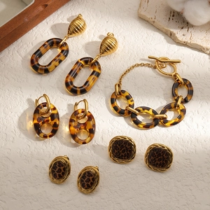 Golden 18K stainless steel leopard print jewelry set with earrings and bracelet