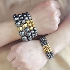 Men's waterproof stainless steel bead bracelet with hematite stones and gold accents
