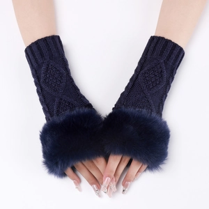 Detailed knit texture of dark blue fingerless gloves with fluffy faux fur cuffs