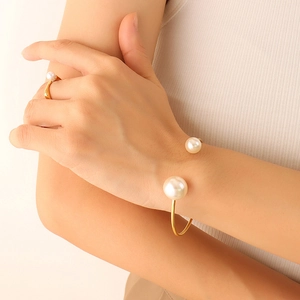 Elegant 18K gold plated pearl open bangle and matching ring set for women on model