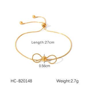 Élégant bracelet serpent en acier inoxydable doré avec nœud papillon et fermoir réglable