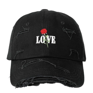 Distressed black cotton baseball cap with rose and LOVE embroidery in a front view
