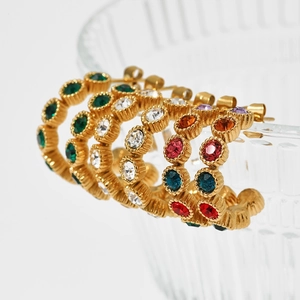 Vintage gold C-shape stud earrings with multicolored rhinestones on glass rim