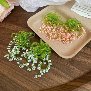 Elegant floral beaded fringe earrings with white pink and green pearls in nature style