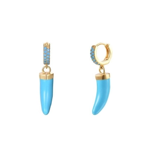 Close-up of golden S925 earrings with blue gemstone inlays and horn-shaped pendants