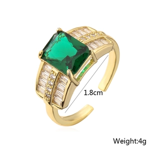 Detail view of 18K gold plated ring with green emerald-cut stone and 1.8cm inner diameter