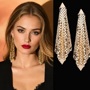 Detail of golden mesh drop earrings featuring 925 sterling silver needles and luxury fringe